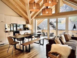 a living room with a couch and a table at Hidden Retreats The Niesen in Reichenbach