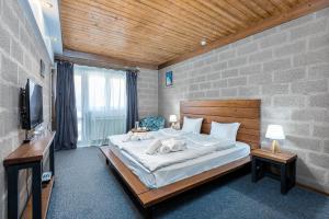 Voodi või voodid majutusasutuse Alpine Lounge Boutique Hotel toas