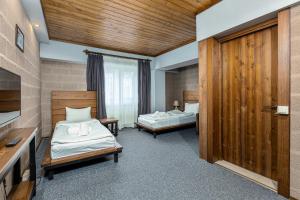 Voodi või voodid majutusasutuse Alpine Lounge Boutique Hotel toas