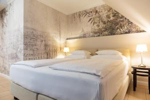 Letto o letti in una camera di Hotel Spiess & Spiess