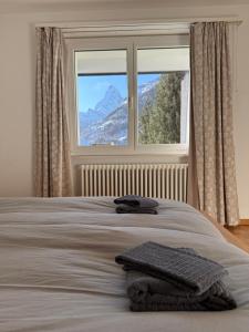 Postel nebo postele na pokoji v ubytování Apartment Snowball, Modern, cosy, Matterhorn views