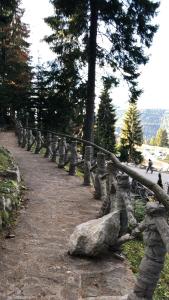 a stone fence on a hill with a rock at Sweet Home Vlasic in Vlasic