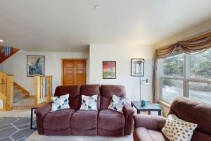 a living room with a couch and a window at Pacific Shorepine in Pacific City