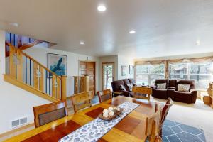 a living room with a wooden table and chairs at Pacific Shorepine in Pacific City