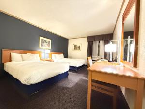 Postel nebo postele na pokoji v ubytování Days Inn by Wyndham Drayton Valley + 20 fotografií