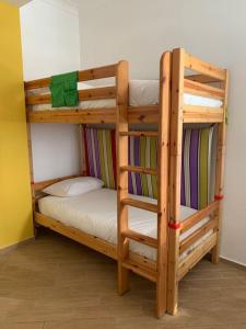 a couple of bunk beds in a room at La Dolce Vita, Vomero in Naples