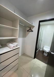 a bathroom with a shower and a toilet in it at Ecuabook torre sol 32 mall del Sol in Guayaquil