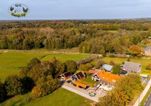an aerial view of a house with a yard at Vakantiehuis Klaartje Kip Enschede tot 4 personen, landelijk gelegen! in Enschede