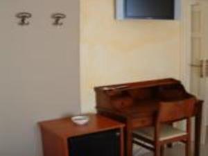 TV a/nebo společenská místnost v ubytování B&B Frammenti D'Itria