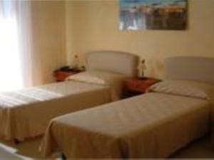 Postel nebo postele na pokoji v ubytování B&B Frammenti D'Itria