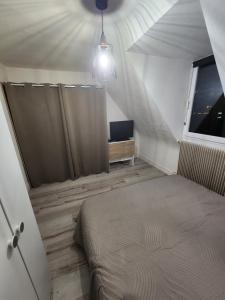 Postel nebo postele na pokoji v ubytování Gîte du logelbach