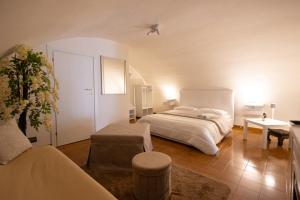 a large bedroom with a bed and a table at Suite16 & spa in Barletta +99 photos