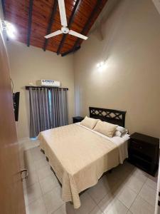 a bedroom with a bed and a ceiling at Amplio Departamento Céntrico in Formosa +11 photos
