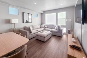 a living room with a couch and a table at Silver Creek Sanctuary - Relax & Explore Park City in Park City