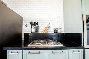 a kitchen with a stove top oven in a kitchen at Family Perfect Getaway 3BR Villa 6 at Playa Venao in Playa Venao +49 photos