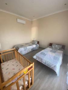 Postel nebo postele na pokoji v ubytování Asante Beach Villa