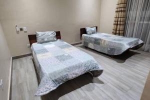 Postel nebo postele na pokoji v ubytování Asante Beach Villa