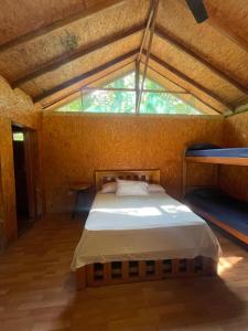 Ένα ή περισσότερα κρεβάτια σε δωμάτιο στο Rancho Cristal Beach