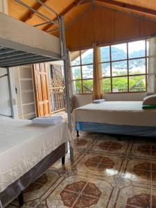 Ένα ή περισσότερα κρεβάτια σε δωμάτιο στο Apartamento Garden para 7 a 8