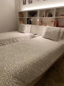 Uma cama ou camas num quarto em Hotel Lusitano