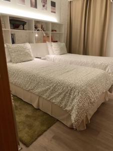 Uma cama ou camas num quarto em Hotel Lusitano