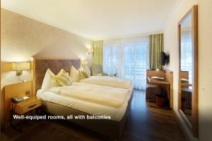 Rúm í herbergi á Hotel Kirchbühl Superior