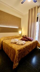 Postel nebo postele na pokoji v ubytování Hotel Villa Camilla