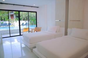 Letto o letti in una camera di Ton Sai Tropical Phi Phi Island