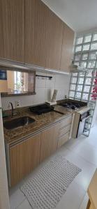 Η κουζίνα ή μικρή κουζίνα στο Apartamento 44 na Enseada Guaruja +8 φωτογραφίες