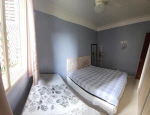 Ένα ή περισσότερα κρεβάτια σε δωμάτιο στο Apartamento 44 na Enseada Guaruja