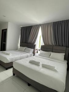 Letto o letti in una camera di TDOZE Hotel
