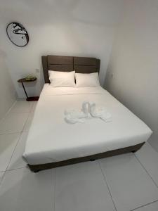 Letto o letti in una camera di TDOZE Hotel
