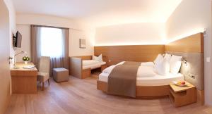 Posteľ alebo postele v izbe v ubytovaní Hotel Post Gries