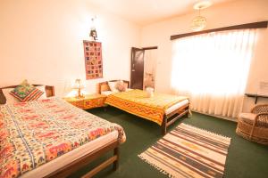 Postel nebo postele na pokoji v ubytování Peace Eye Guest House