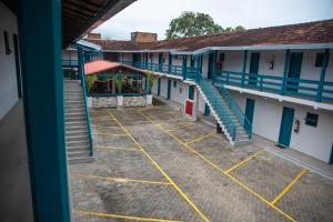an overhead view of the courtyard of a school building at Hotel Praia do Morro in Guarapari +8 photos