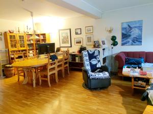 a living room with a table and a couch at Teglverket in Trondheim