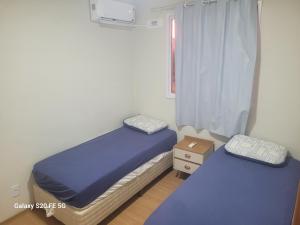 Ένα ή περισσότερα κρεβάτια σε δωμάτιο στο Residencial Jardim da costa +25 φωτογραφίες