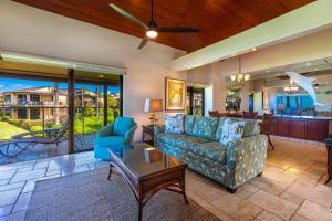 a living room with a couch and a table at WAILEA ELUA, #1302 condo in Wailea