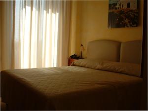 Postel nebo postele na pokoji v ubytování B&B Frammenti D'Itria
