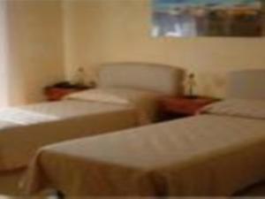 Postel nebo postele na pokoji v ubytování B&B Frammenti D'Itria