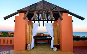 a gazebo with a view of the ocean at Royal Hideaway Sancti Petri in Chiclana de la Frontera