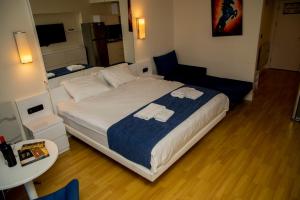 Postel nebo postele na pokoji v ubytování VIP APARTmENTS N2