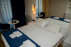 Postel nebo postele na pokoji v ubytování VIP APARTmENTS N2
