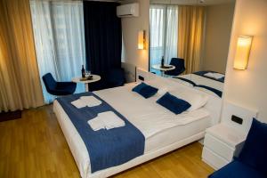 Postel nebo postele na pokoji v ubytování VIP APARTmENTS N2