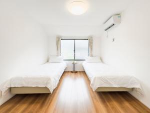 Postel nebo postele na pokoji v ubytování 池袋本町-池袋新房北池袋车站5分钟 一室二张床