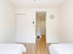 Postel nebo postele na pokoji v ubytování 池袋本町-池袋新房北池袋车站5分钟 一室二张床