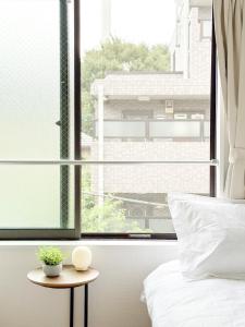 Postel nebo postele na pokoji v ubytování 池袋本町-池袋新房北池袋车站5分钟 一室二张床