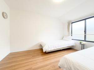 Postel nebo postele na pokoji v ubytování 池袋本町-池袋新房北池袋车站5分钟 一室二张床