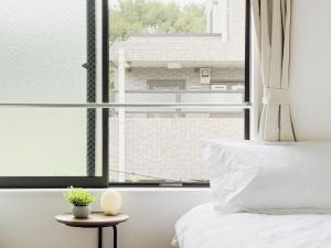 Postel nebo postele na pokoji v ubytování 池袋本町-池袋新房北池袋车站5分钟 一室二张床