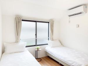 Postel nebo postele na pokoji v ubytování 池袋本町-池袋新房北池袋车站5分钟 一室二张床